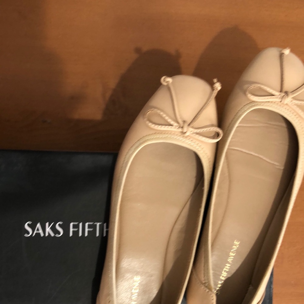Size 6 ballet flat, color dove. Never worn.  Brand: Saks Fifth Ave.